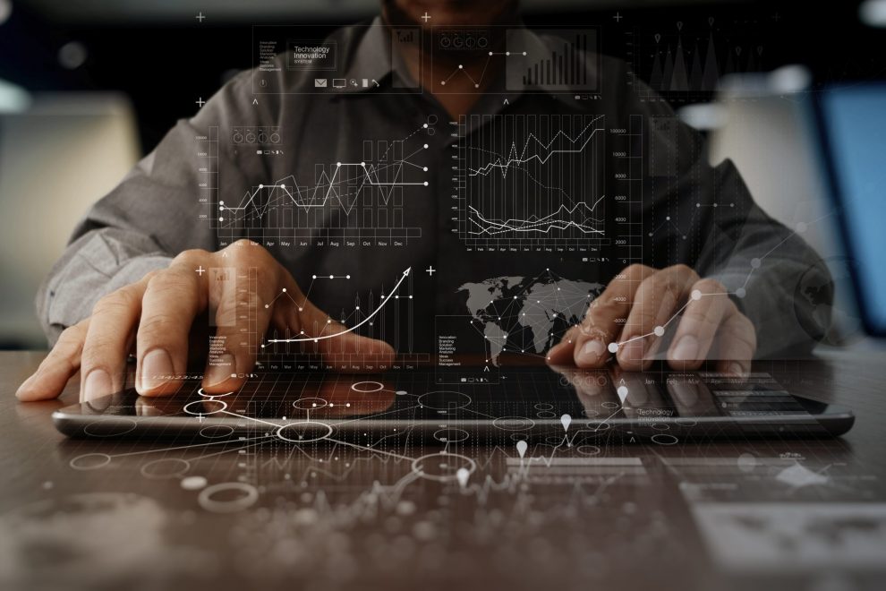 business man hand working on laptop computer with digital layer