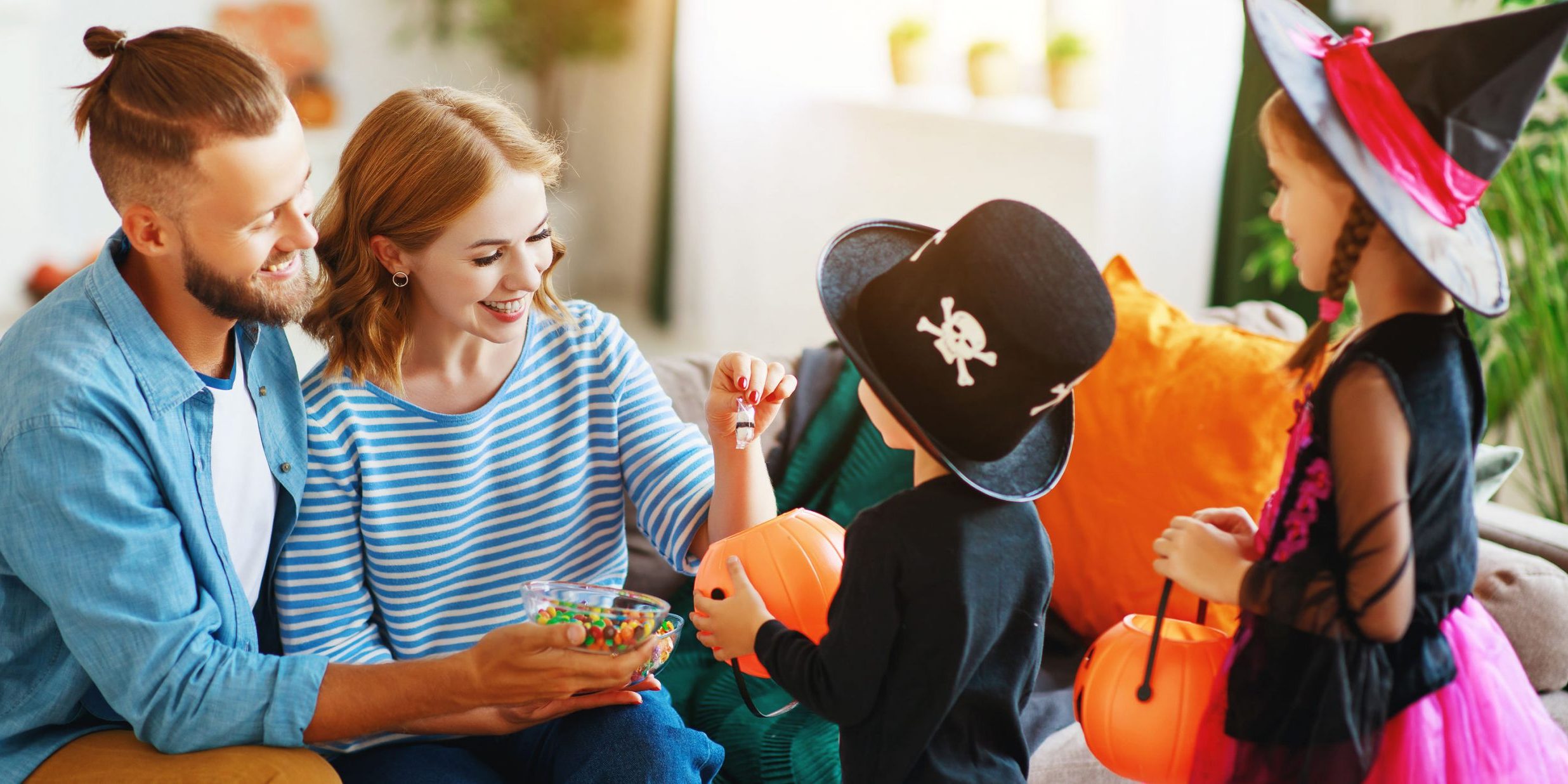 holiday  Halloween. children ask their parents for candy in costumes