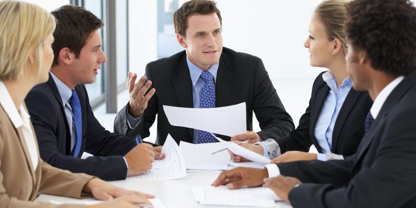 Group Of Business People Having Meeting In Office
