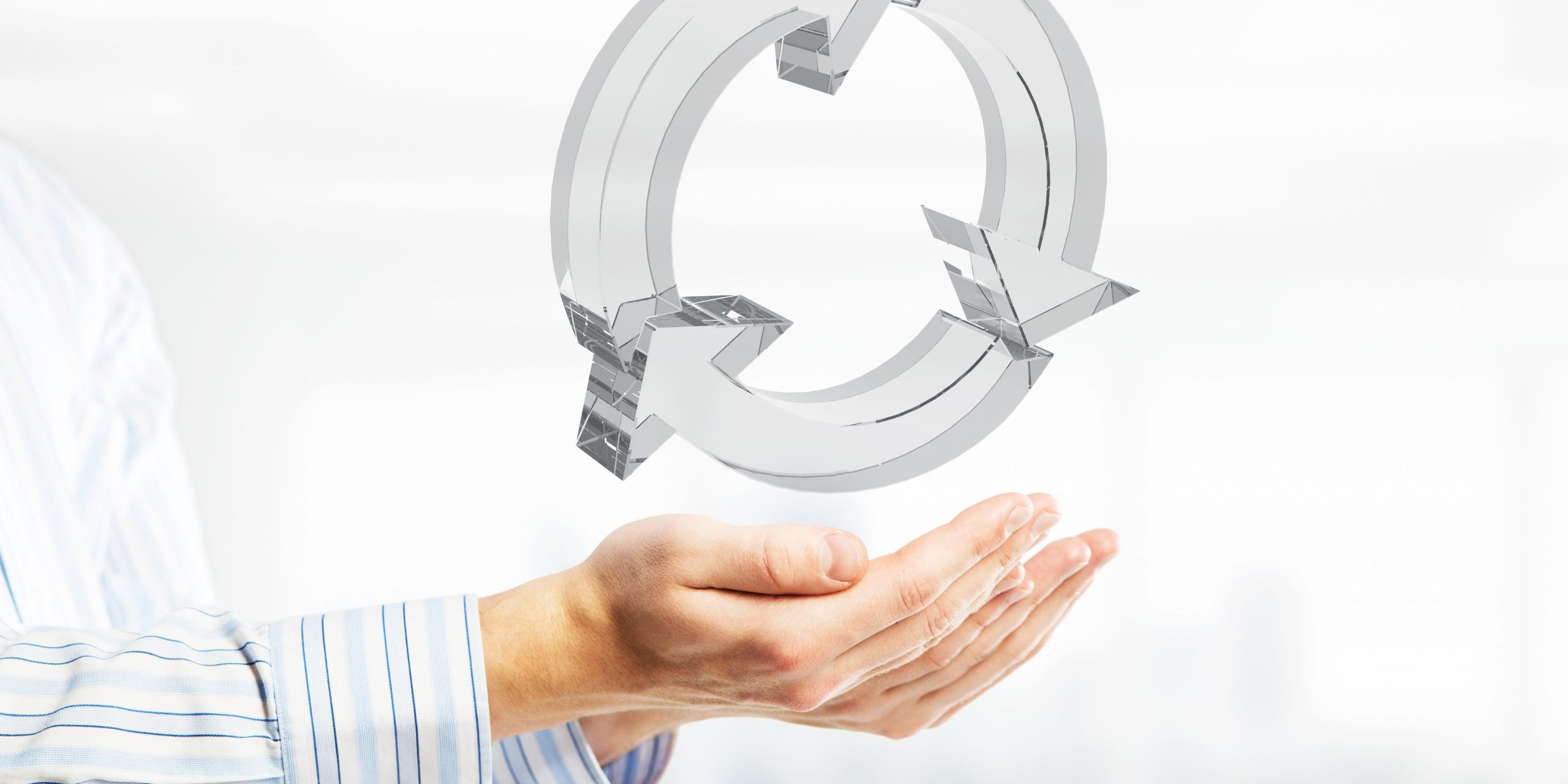 Web refresh icon in male hands as symbol for internet use. Mixed media