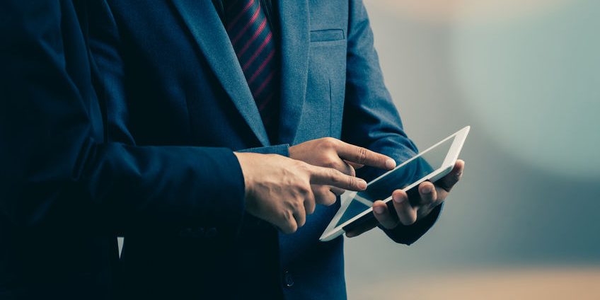 two businessmen using tablet-pc : filtered process
