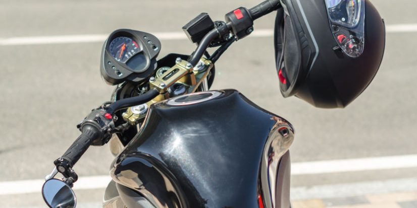 modern motorcycle cafe racer and black helmet on a city street c