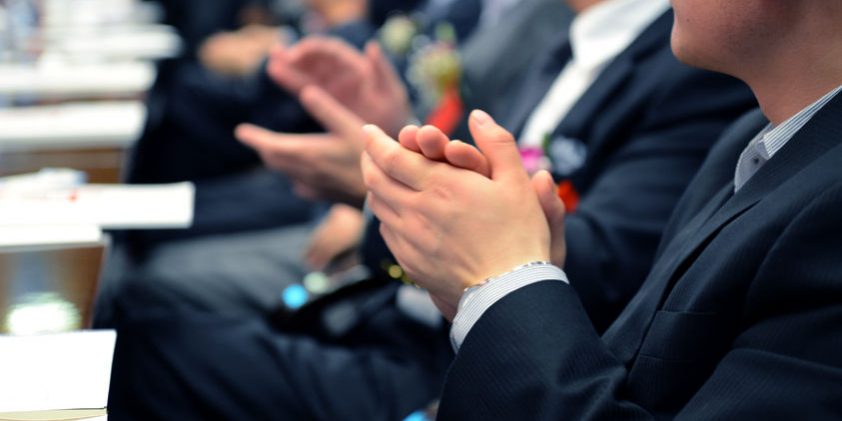 applauding at meeting