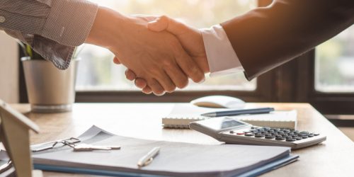 Top,View,Hands,Of,Agent,And,Client,Shaking,Hands,After