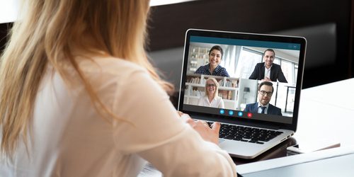 Back,View,Of,Businesswoman,Speak,Using,Webcam,Conference,On,Laptop