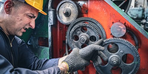 Industrial,Worker,Getting,His,Finger,Stuck,In,The,Machine.,Workplace