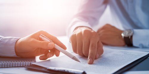 Business,People,Negotiating,A,Contract.,Human,Hands,Working,With,Documents
